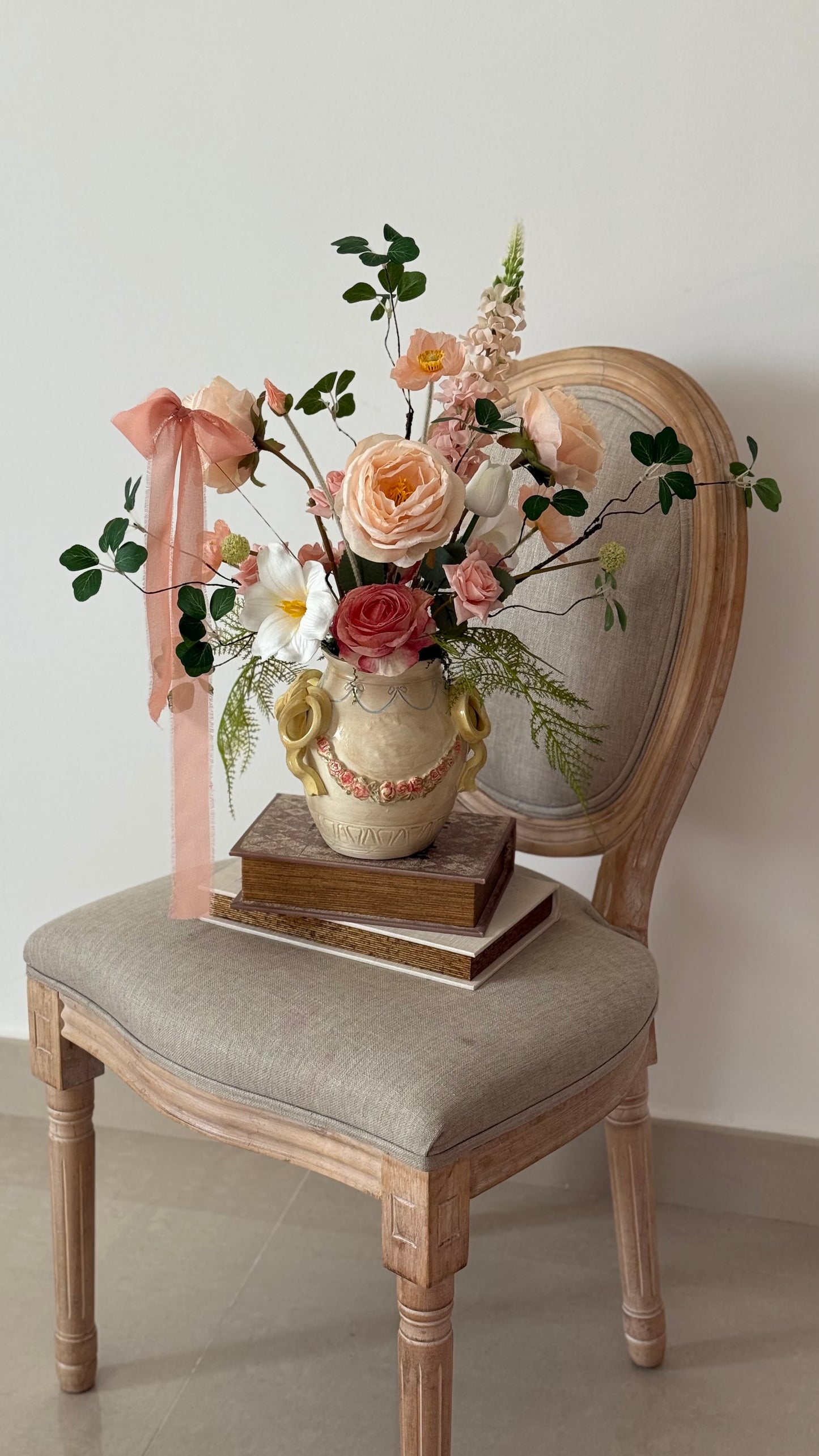 Ceramic bow details flower arrangement