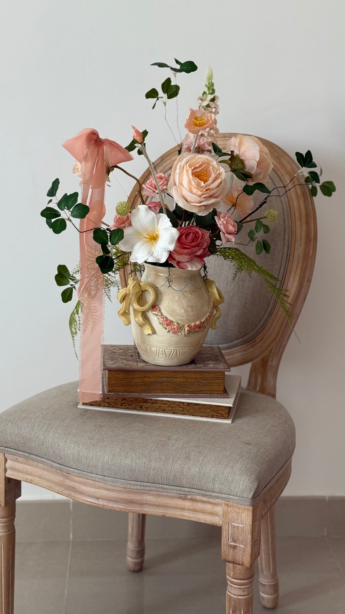 Ceramic bow details flower arrangement