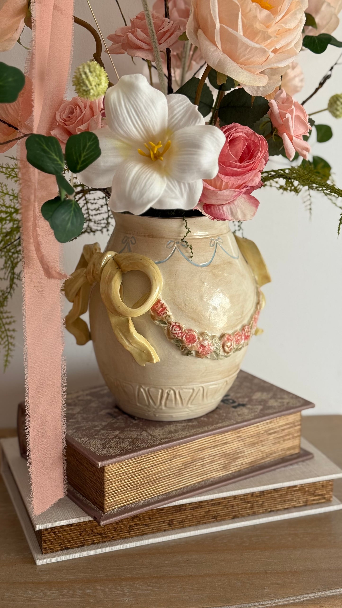 Ceramic bow details flower arrangement