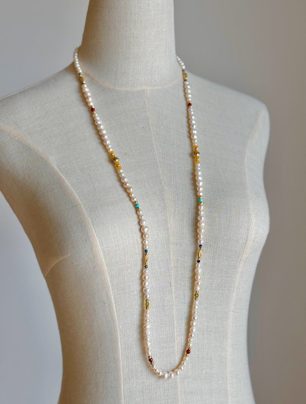 Extra long pearl necklace with colorful stones