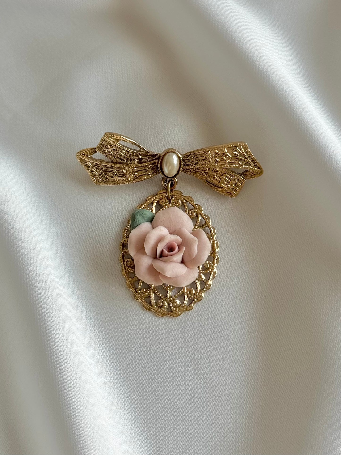 Vintage bow and ceramic rose brooch