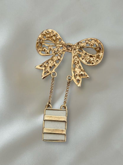 Vintage gold bow brooch with crystals and hanging frame