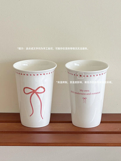 Long white ceramic glass with bow design