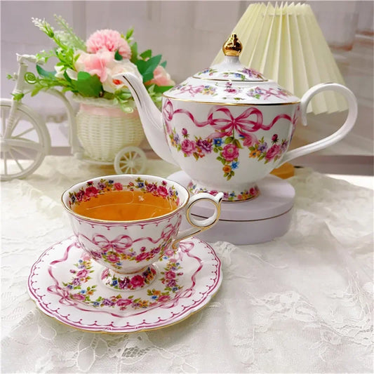 Vintage style bow style Teapot and Teacup Saucer