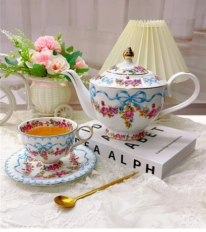 Vintage style bow style Teapot and Teacup Saucer