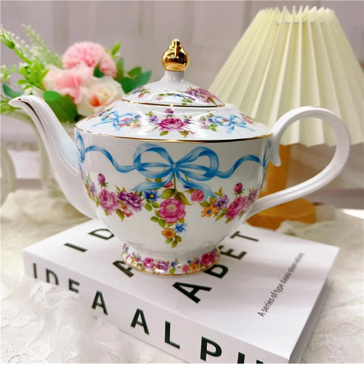 Vintage style bow style Teapot and Teacup Saucer