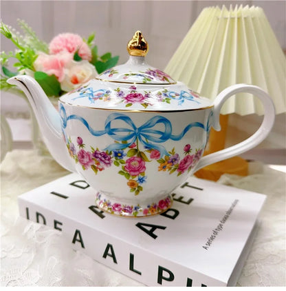 Vintage style bow style Teapot and Teacup Saucer