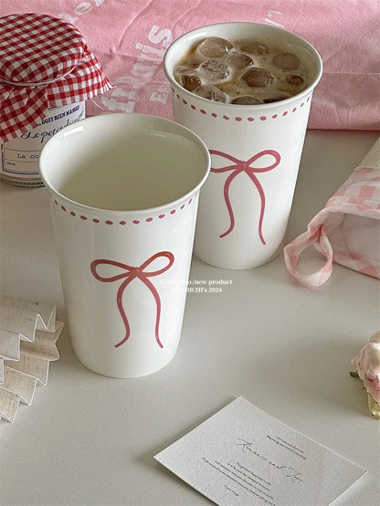 Long white ceramic glass with bow design