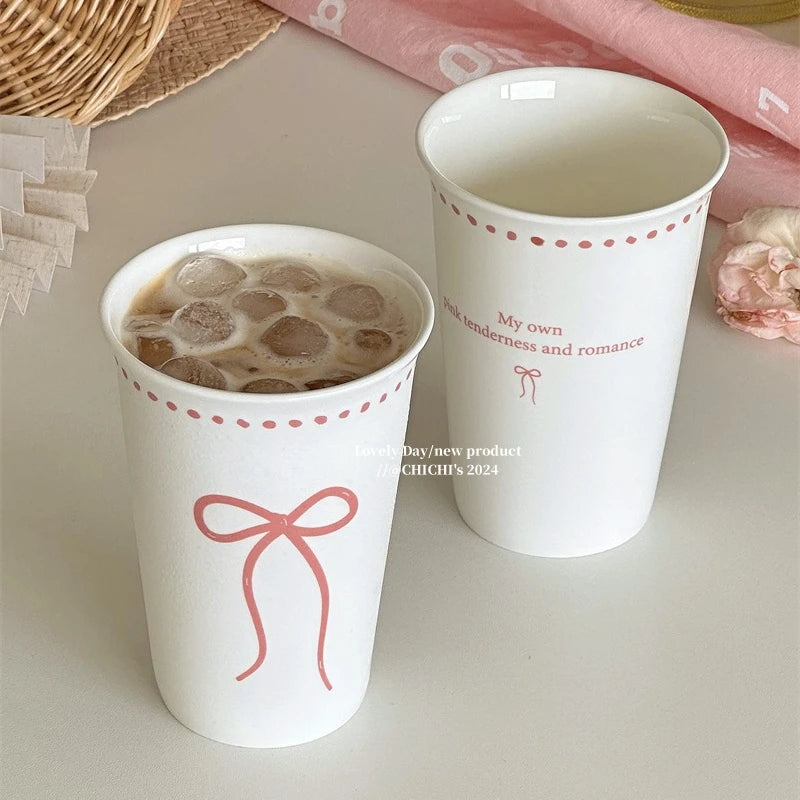 Long white ceramic glass with bow design