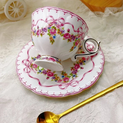 Vintage style bow style Teapot and Teacup Saucer