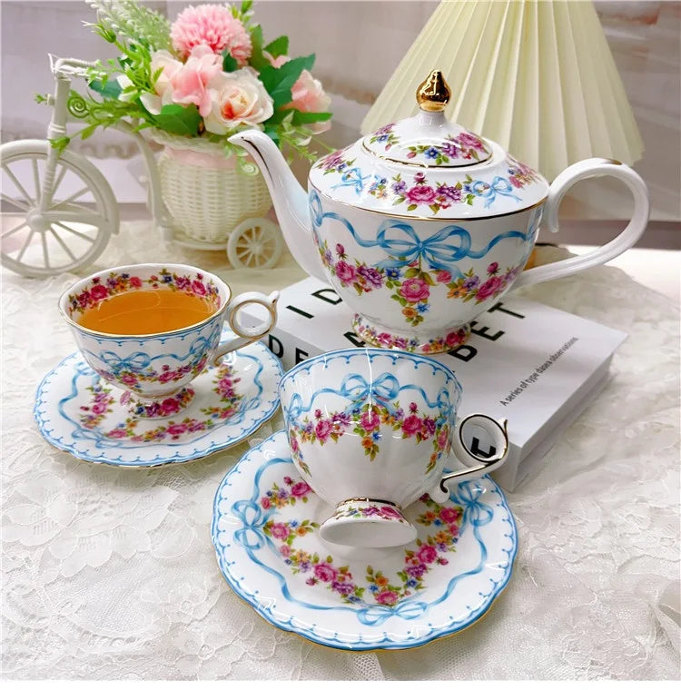 Vintage style bow style Teapot and Teacup Saucer