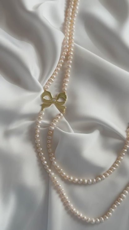 Gold plated silver Bows in 2 lines of real fresh water Pearls